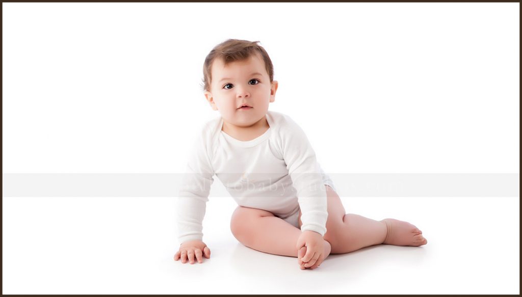 Six month old baby photographed during a professional milestone portrait session Six month old baby photographed during a professional milestone portrait session