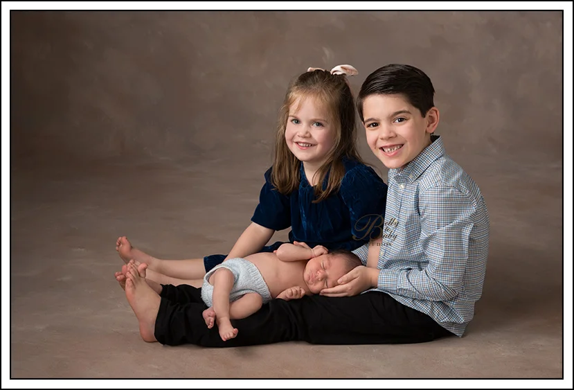 Houston Maternity Photographer Houston Newborn Family Portraits featuring parents and newborn baby in neutral clothing.