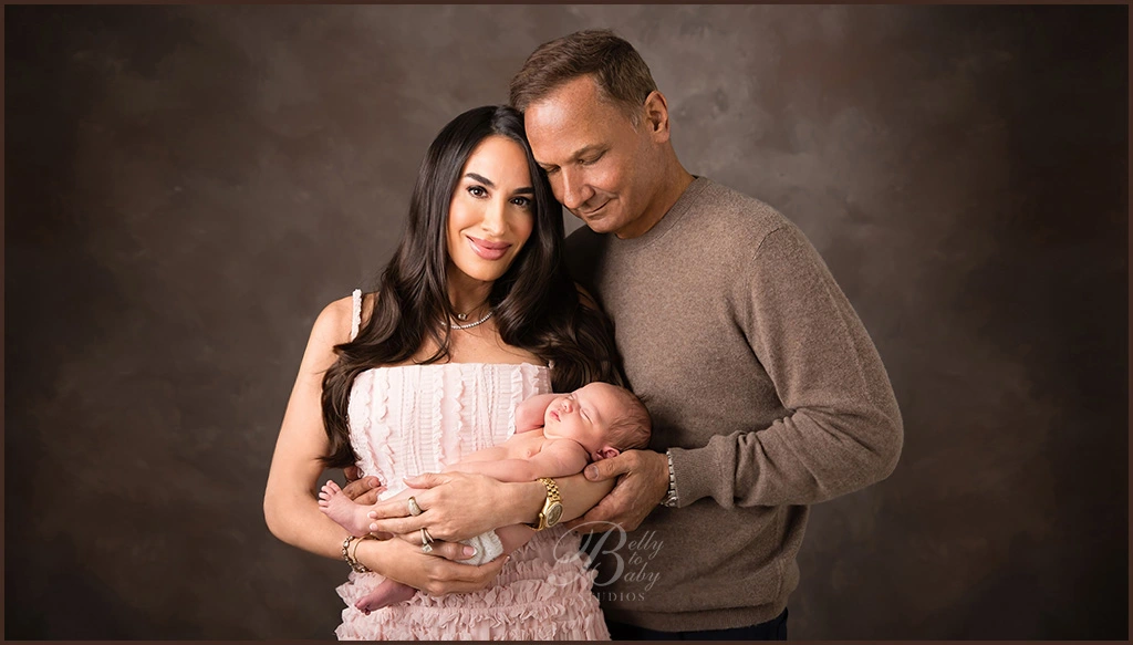 Houston newborn family portrait with mother, father, and baby. Houston newborn family portrait with mother, father, and baby.