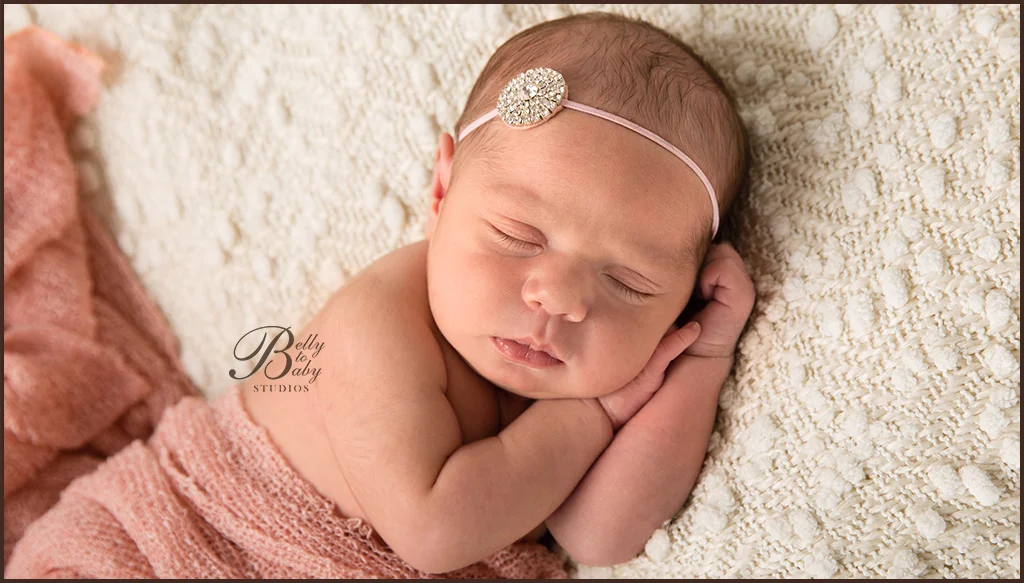 newborn baby resting on soft studio blanket newborn baby resting on soft studio blanket