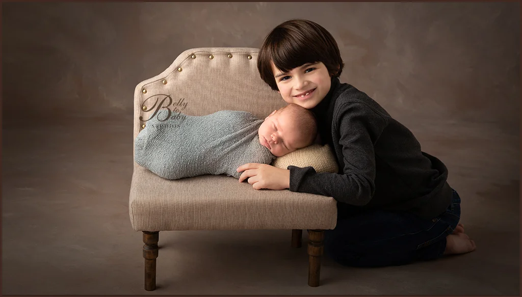 Family portrait with older sibling at Belly to Baby Studios in Houston. Family portrait with older sibling at Belly to Baby Studios in Houston.