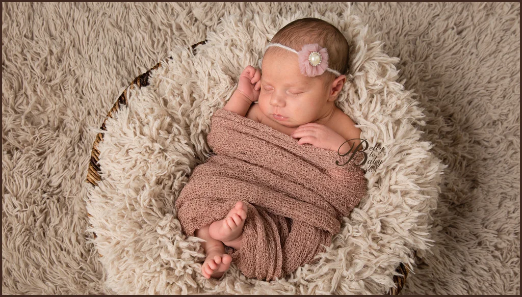 sleeping newborn baby wrapped in neutral blanket sleeping newborn baby wrapped in neutral blanket